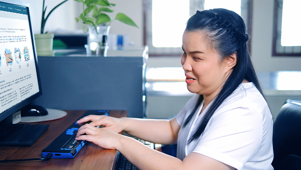 A visually impaired woman accessing Group website.