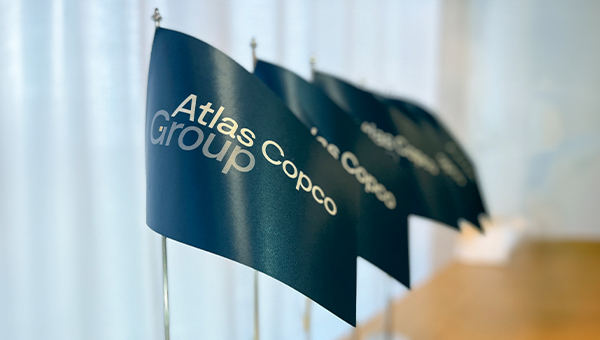 A row of Group flags placed on a table.