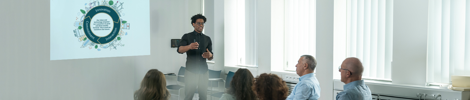 A confident man presenting the Group purpose to his team.