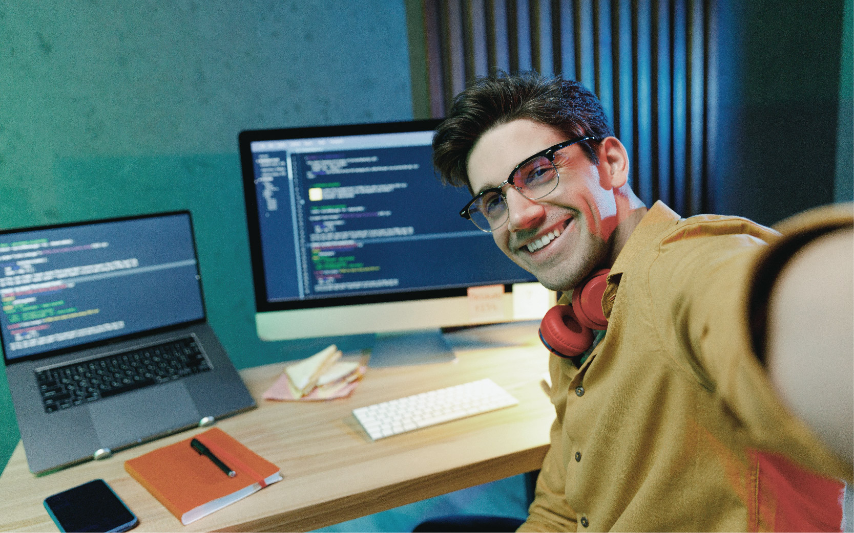Employee taking a selfie at their coding workstation